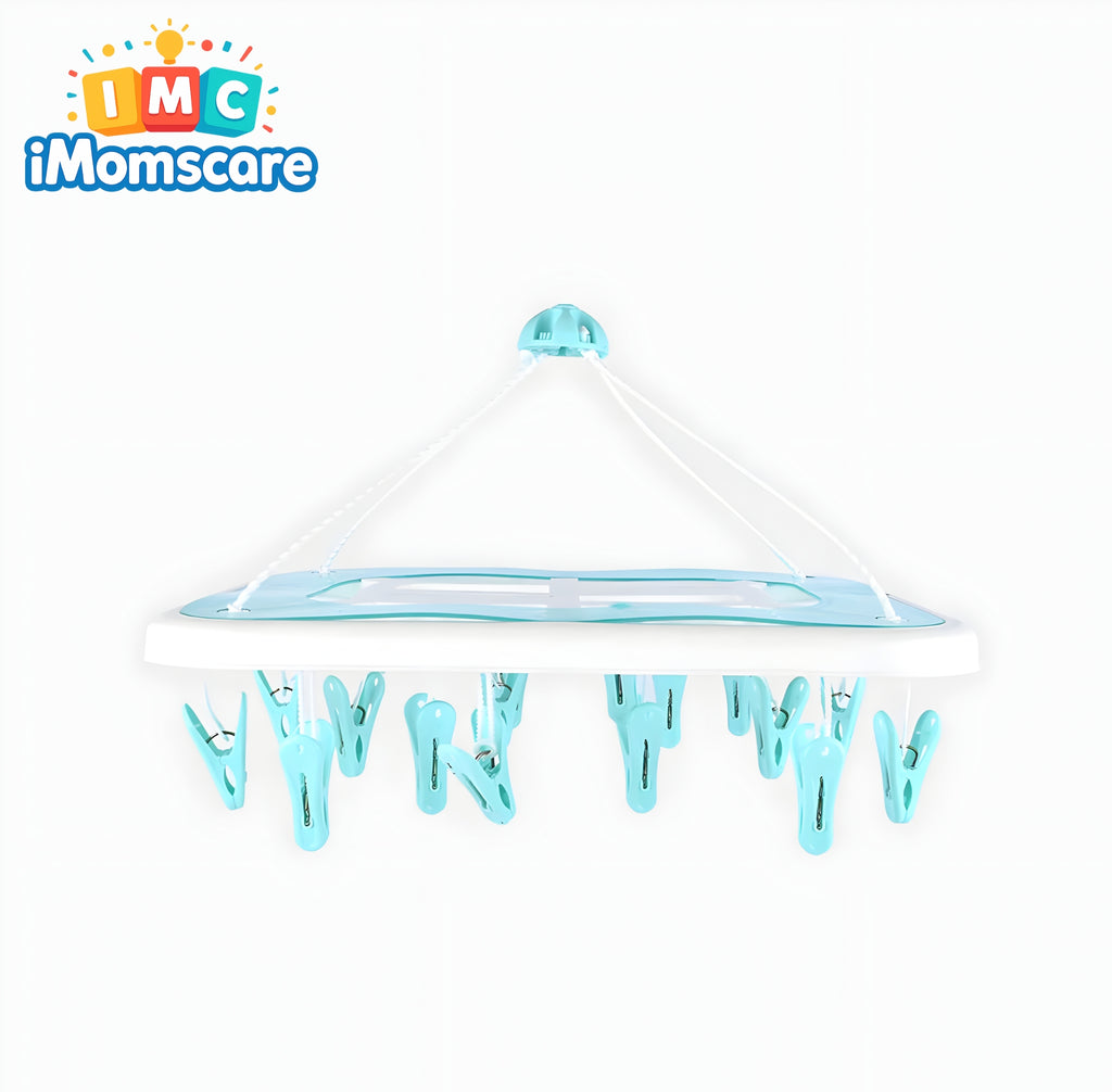 Baby crib with blue clips on a white background, featuring the iMomscare logo.